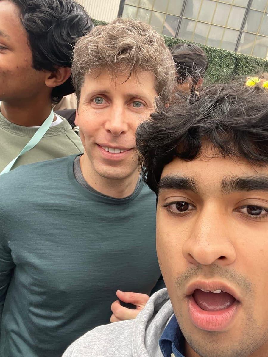 me taking a photo with sam altman at startup school, 2024